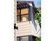 Architectural detail of exterior window with sunshades, revealing a modern lamp inside at 3069 Tejon St # B, Denver, CO 80211