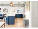 Open kitchen features a large island with modern pendants and stainless steel appliances at 3069 Tejon St # B, Denver, CO 80211