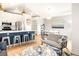Bright living room featuring modern decor and open floor plan, seamlessly connecting the kitchen and dining areas at 3069 Tejon St # B, Denver, CO 80211