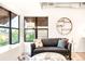 Comfortable living room with large windows, a modern sofa, and stylish decor at 3069 Tejon St # B, Denver, CO 80211