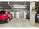 A well-lit parking garage with concrete walls, and storage units in a secure, interior setting at 3069 Tejon St # B, Denver, CO 80211