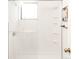 Clean, white shower with glass door and a built in shelving at 3069 Tejon St # B, Denver, CO 80211