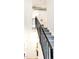 Modern staircase with sleek black railings leading to the upper level of the home at 3069 Tejon St # B, Denver, CO 80211