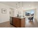 Kitchen island with stainless steel dishwasher, and stainless steel sink at 6153 N Ceylon St # 203, Denver, CO 80249