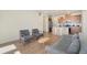 Open concept floor plan with living room and kitchen at 6153 N Ceylon St # 203, Denver, CO 80249