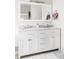 Elegant bathroom featuring double sinks, sleek white cabinetry, and modern fixtures at 2252 Harlan St, Edgewater, CO 80214