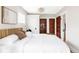 Comfortable bedroom boasting a modern bed frame, two closets, and a neutral color palette at 2252 Harlan St, Edgewater, CO 80214