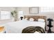 Cozy bedroom featuring bright windows, modern decor, and a comfortable king-size bed at 2252 Harlan St, Edgewater, CO 80214