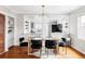 Dining room with modern light fixture opens to updated kitchen; great flow for entertaining at 2252 Harlan St, Edgewater, CO 80214
