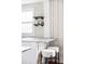 Stylish kitchen with modern bar seating and open shelving to maximize space at 2252 Harlan St, Edgewater, CO 80214