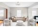 Inviting living room featuring modern furniture, neutral tones, and ample natural light at 2252 Harlan St, Edgewater, CO 80214