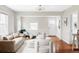 Comfortable living room with hardwood floors, stylish seating, and a bright, airy feel at 2252 Harlan St, Edgewater, CO 80214