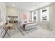 Cozy bedroom with a bed, a desk, and bright windows at 5566 Hickory Oaks Trl, Castle Rock, CO 80104