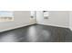 Bedroom with multiple windows, neutral walls, and gray flooring at 5566 Hickory Oaks Trl, Castle Rock, CO 80104