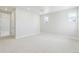 Bright bedroom with carpet, neutral walls, and ample natural light from large windows at 5566 Hickory Oaks Trl, Castle Rock, CO 80104