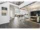 Bright foyer with dark wood floors, glass-enclosed office, and an open floor plan leading to the living and dining areas at 5566 Hickory Oaks Trl, Castle Rock, CO 80104