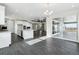 Bright, open-concept kitchen featuring modern white cabinets and a large island with stainless steel appliances at 5566 Hickory Oaks Trl, Castle Rock, CO 80104