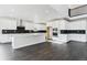 Bright kitchen features white cabinets, stainless steel appliances, an island, and hardwood floors at 5566 Hickory Oaks Trl, Castle Rock, CO 80104