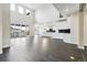 Spacious living room and kitchen featuring hardwood floors, a fireplace, and large sliding glass doors at 5566 Hickory Oaks Trl, Castle Rock, CO 80104