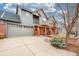 Spacious two-car garage and driveway with landscaped front yard showcasing this lovely home at 84 Inca St, Denver, CO 80223
