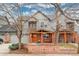 Charming two-story home with a welcoming front porch swing and well-maintained landscaping at 84 Inca St, Denver, CO 80223