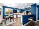 Modern kitchen featuring stainless steel appliances, granite countertops, and an adjacent dining area perfect for entertaining at 84 Inca St, Denver, CO 80223