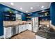 Well-appointed kitchen showcasing stainless steel appliances, granite countertops, and ample cabinet space at 84 Inca St, Denver, CO 80223