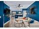 Open-concept living area featuring a stylish sofa, modern decor, and a view of the dining area at 84 Inca St, Denver, CO 80223