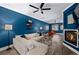 Spacious living room with a comfortable sectional sofa, fireplace, and stylish decor at 84 Inca St, Denver, CO 80223