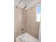 Shower-tub featuring tan tiling and a shower-head at 84 Inca St, Denver, CO 80223