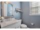 Stylish half bathroom featuring a vanity with marble countertop and modern fixtures at 2538 Ambience Ln, Castle Rock, CO 80109