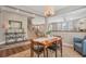 Inviting dining area with hardwood floors and an open layout to the kitchen and living spaces at 2538 Ambience Ln, Castle Rock, CO 80109