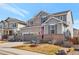 Well-maintained two-story home with a spacious driveway and a nicely landscaped front yard at 2538 Ambience Ln, Castle Rock, CO 80109