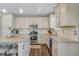 Bright kitchen featuring granite countertops, stainless steel appliances, and ample cabinet space at 2538 Ambience Ln, Castle Rock, CO 80109