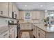 Elegant kitchen with wooden floors, granite countertops, and stainless steel appliances at 2538 Ambience Ln, Castle Rock, CO 80109