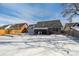 Spacious backyard with raised garden beds and home view at 639 Quartz Way, Broomfield, CO 80020