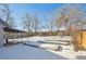 Large backyard with raised garden beds and covered patio at 639 Quartz Way, Broomfield, CO 80020