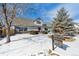 Desirable home with snowy lawn, attractive landscaping, and professionally installed for sale sign at 639 Quartz Way, Broomfield, CO 80020