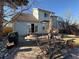 Enjoy outdoor dining on this stamped concrete patio with table, chairs, umbrella, and landscaped surroundings at 6044 S Yakima St, Aurora, CO 80015