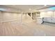Spacious finished basement with a wet bar, offering versatile living space at 9451 E Evans Pl, Denver, CO 80231