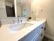 Bathroom boasts dual sinks and a spacious vanity with ample counter space at 9451 E Evans Pl, Denver, CO 80231