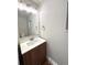 Updated half bathroom with a modern vanity, stylish fixtures, and neutral color scheme at 9451 E Evans Pl, Denver, CO 80231