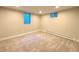 Carpeted bedroom featuring natural lighting, baseboard heating, and neutral colored walls at 9451 E Evans Pl, Denver, CO 80231
