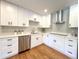 Stylish kitchen featuring stainless appliances, quartz countertops, and modern cabinetry at 9451 E Evans Pl, Denver, CO 80231