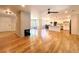 Spacious open-concept living area adjacent to eat-in kitchen with fireplace and lots of natural light at 9451 E Evans Pl, Denver, CO 80231
