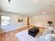 Well-lit living area with hardwood floors, a comfortable sofa, and a decorative rug at 9451 E Evans Pl, Denver, CO 80231