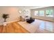 Cozy living room with hardwood floors, neutral tones, and stylish decor, perfect for relaxation at 9451 E Evans Pl, Denver, CO 80231