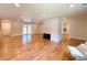 Spacious living area with hardwood floors, modern fireplace, and French doors leading to outdoor space at 9451 E Evans Pl, Denver, CO 80231