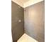 Contemporary tiled shower with modern fixtures and a neutral color palette at 9451 E Evans Pl, Denver, CO 80231