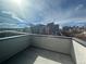 Balcony view featuring the building, a neighborhood street, and a blue sky with scattered clouds at 2330 Eliot St # 1, Denver, CO 80211